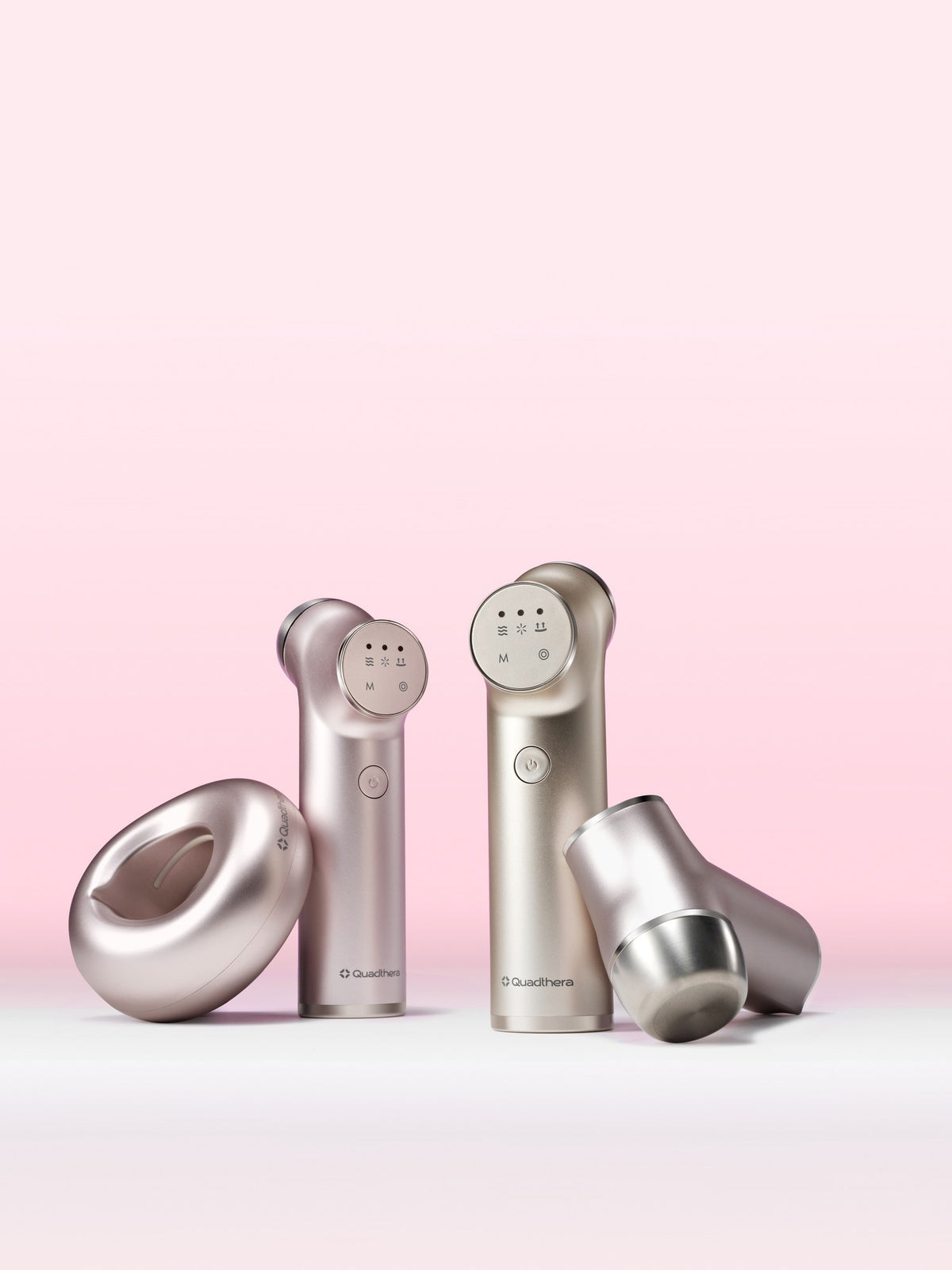 Minititan Charging Cradle beside Minititan devices on a soft pink backdrop (Minititan sold separately)